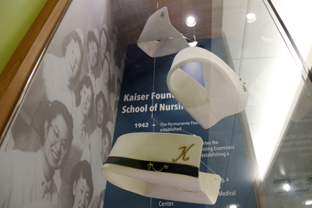 The ceramic nursing caps are modeled after caps worn by students at the Kaiser Foundation School of Nursing.