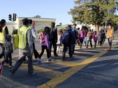 Parent volunteers lead and bring up the rear on the walking school buses. 