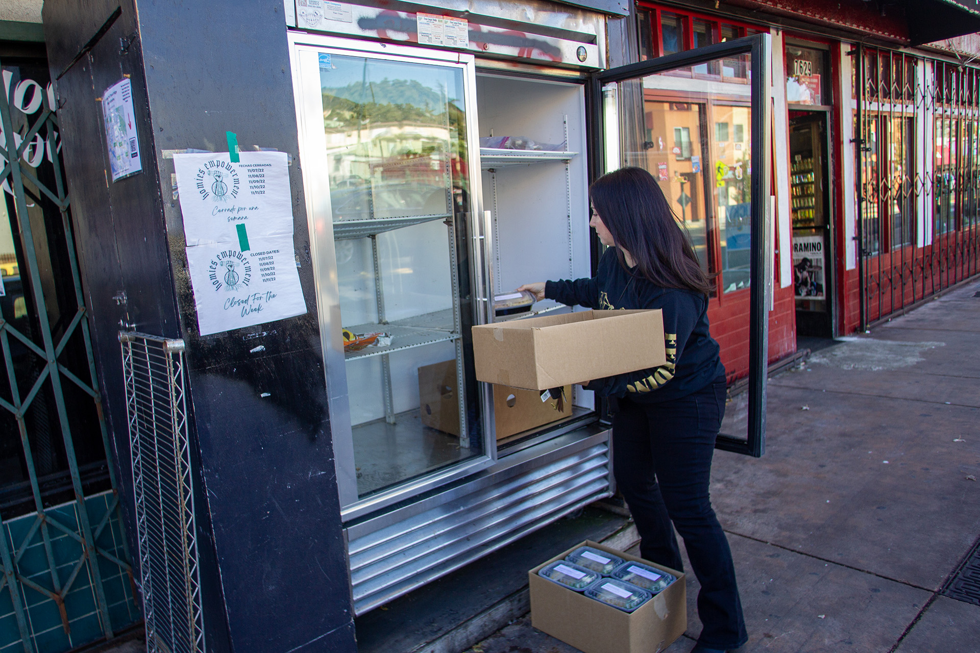 Audrey Rieben delivers home cooked meals to a free refrigerator in East Oakland.