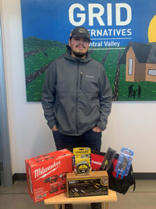 Mark Ramirez with the bag of tools provided to trainees at no charge when they receive a job.